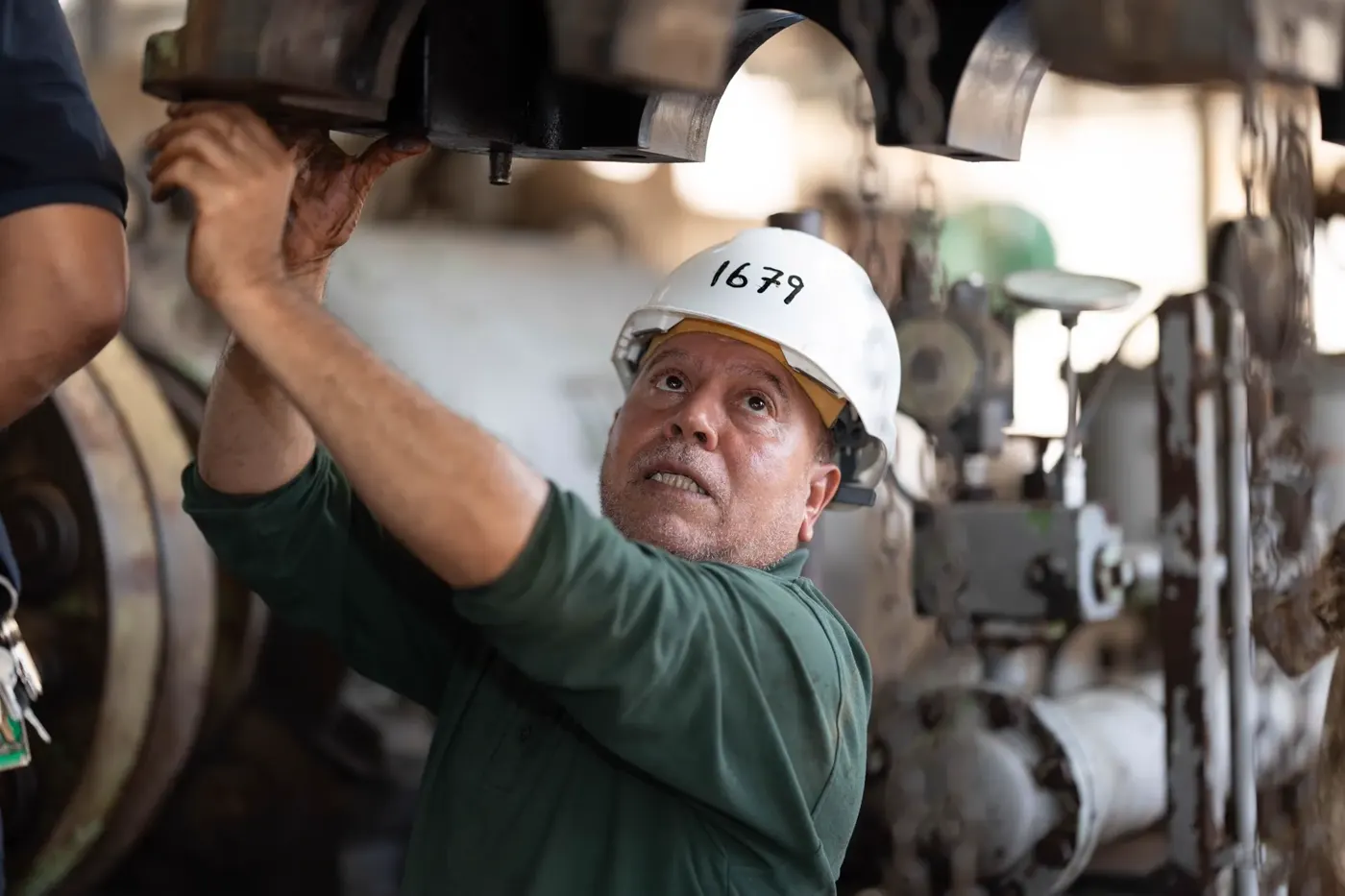 Engineer inspecting industrial machinery on site