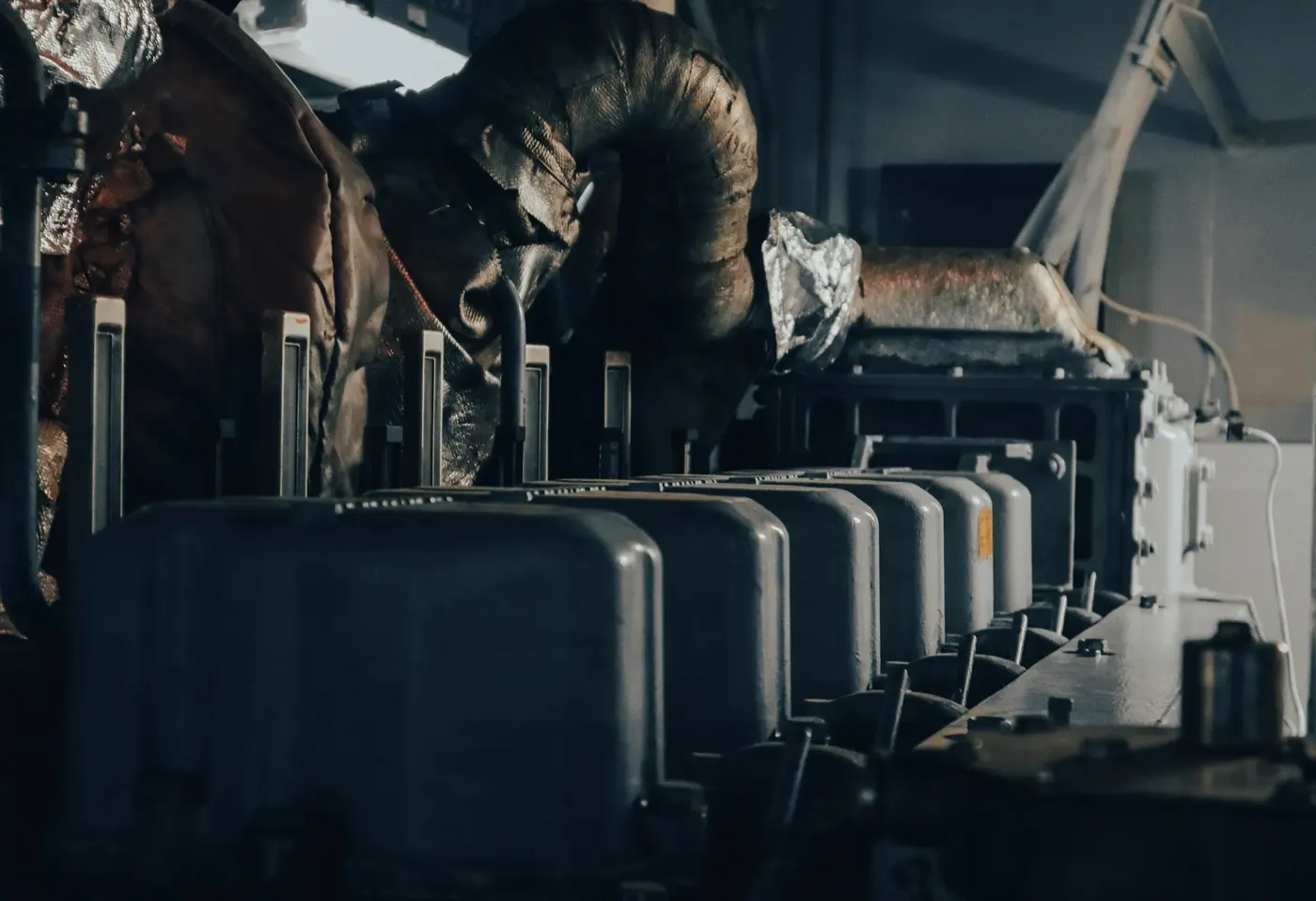 Technician performing preventive maintenance on a generator