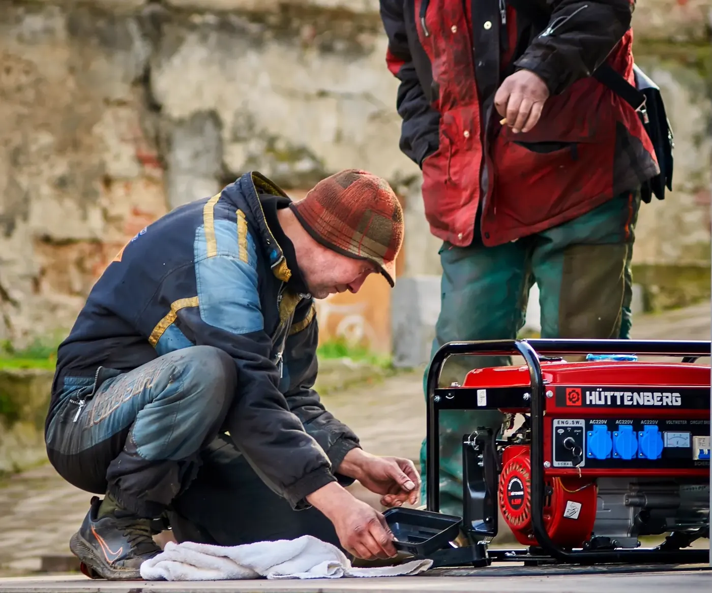 Technicians servicing an industrial power generator